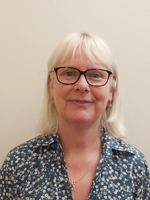 A self portait of Vicky smiling.